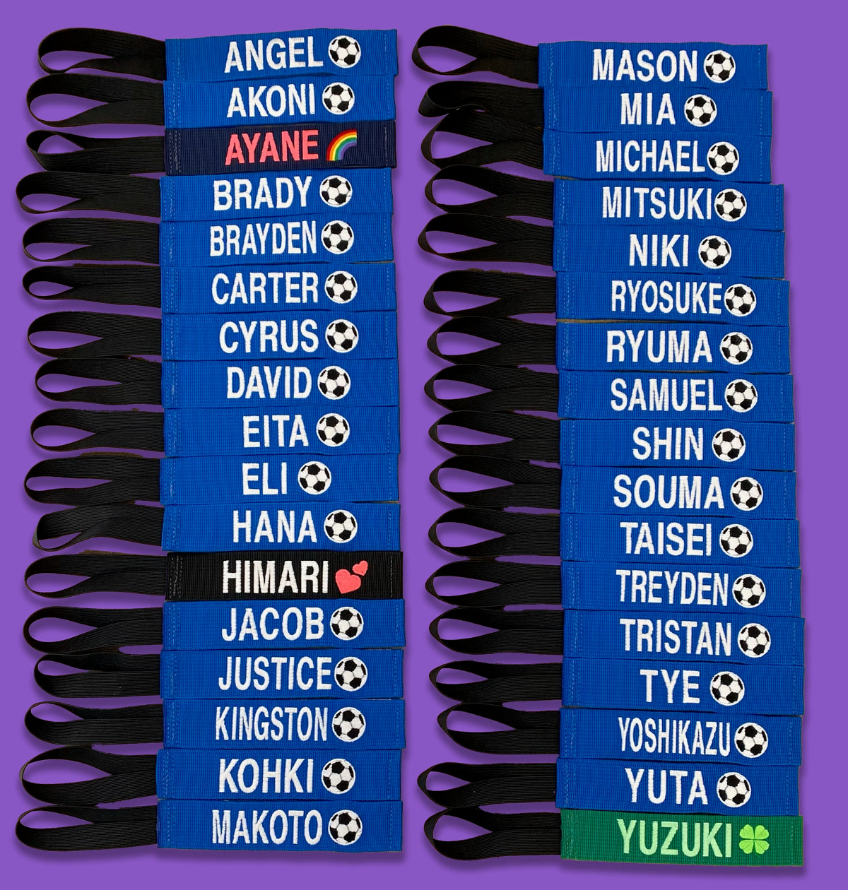 Two columns of blue embroidered bag tags with player names and soccer balls