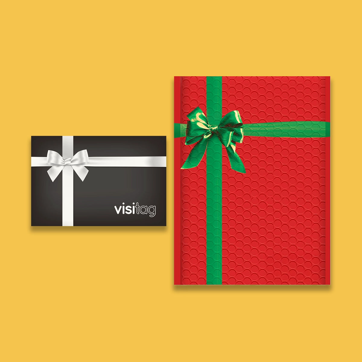 Black Visitag card with a white bow next to a red gift envelope tied with a green ribbon